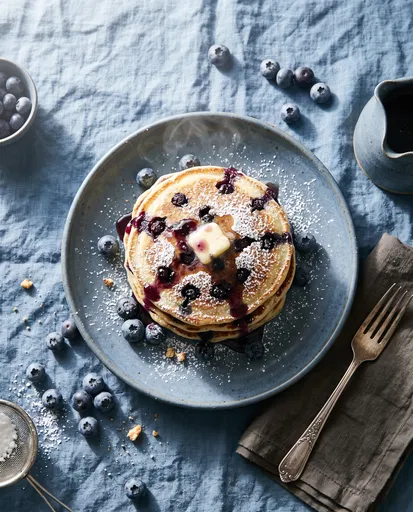 Blueberry Pancakes Flat Lay on Blue Linen