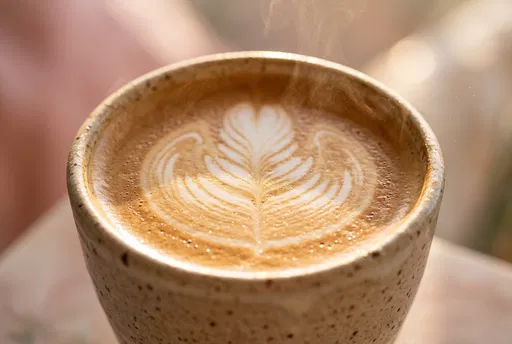 Macro Close-Up of Steaming Latte Art