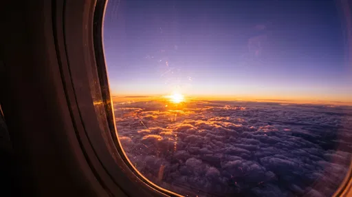 Sunset Over Clouds From Airplane Window