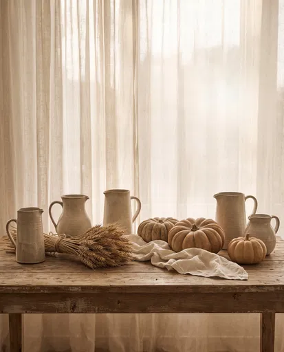 Rustic Autumn Table With Pitchers and Pumpkins