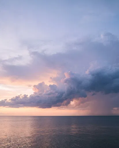 Pastel Storm Clouds Over Calm Dusk Sea