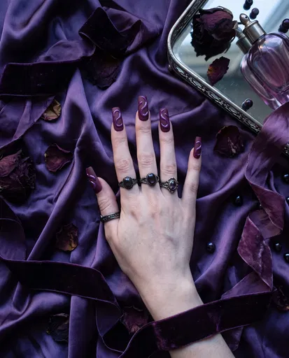 Hand With Purple Matte Swirl Nail Art