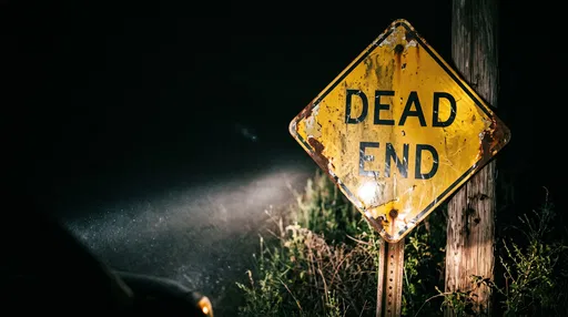 Rusted Dead End Sign at Night