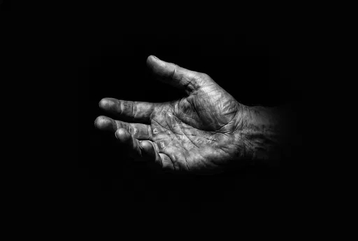 Monochrome Calloused Hand On Black Background
