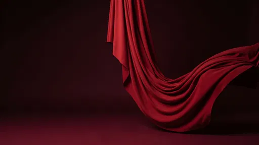 Flowing Red Fabric on Dark Background