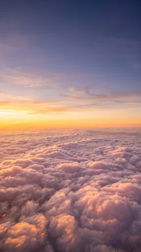 Golden Sunset Above Pastel Clouds