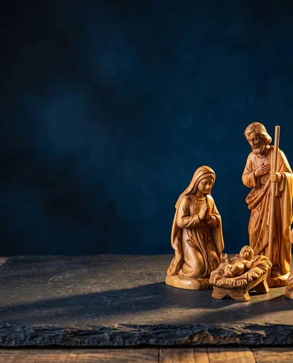 Carved Wooden Nativity Scene on Slate