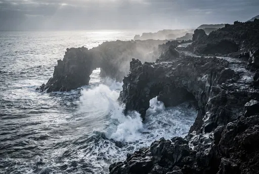 Waves Crashing on Dark Volcanic Coastline
