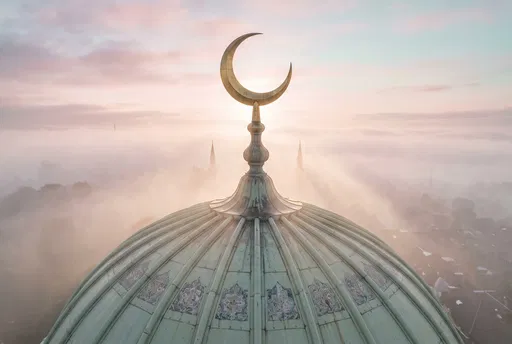 Mosque Dome and Crescent in Morning Mist