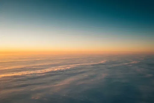 Golden Hour Aerial View Above Clouds
