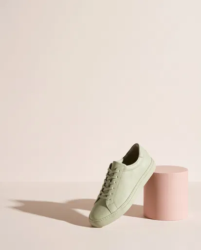 Pastel Pistachio Sneaker on Pink Cylinder