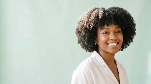 Smiling Woman with Natural Coily Bob
