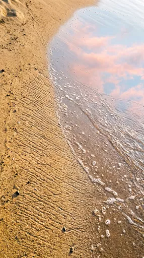 Golden Beach Sand and Dawn Reflection