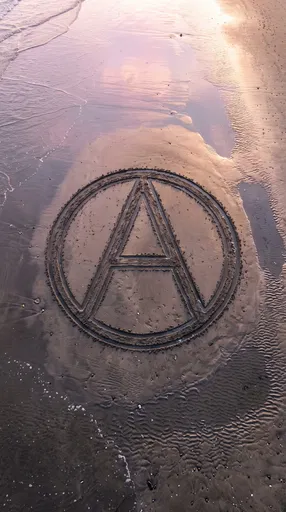 Circle-A Symbol Carved in Wet Beach Sand