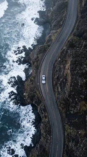 Aerial View of Car on Coastal Highway