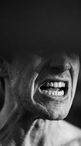 Monochrome Close-Up of Angry Shouting Mouth