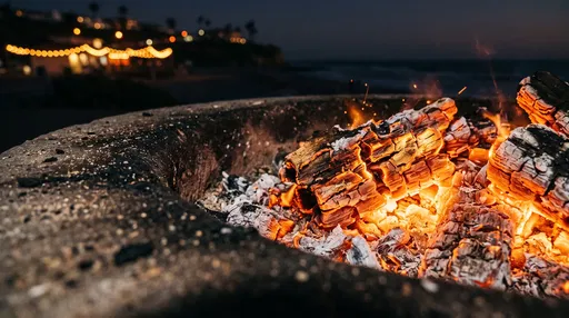Glowing Beach Bonfire Embers at Night