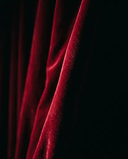 Crimson Velvet Curtain Folds in Shadow