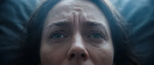 Close-Up of Worried Woman With Furrowed Brow
