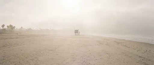 Misty Morning Beach with Lifeguard Stand