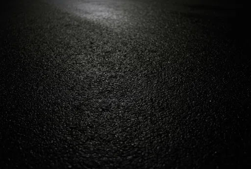 Dark Textured Wet Asphalt Background