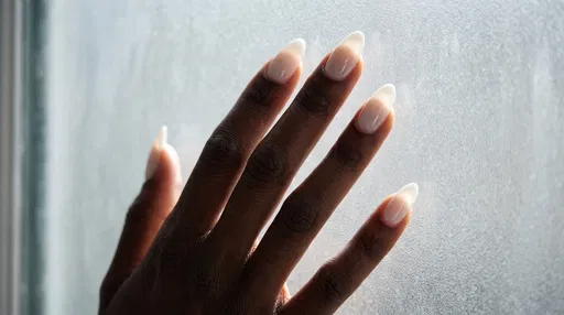 Manicured Hand with Milky White Nails