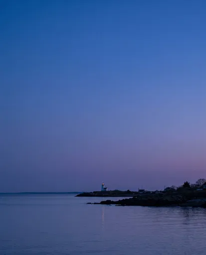 Distant Lighthouse at Blue Hour Twilight
