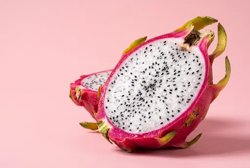 Fresh Halved Dragon Fruit on Pink Background