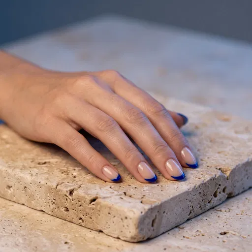Manicured Hand With Blue Micro French Tips