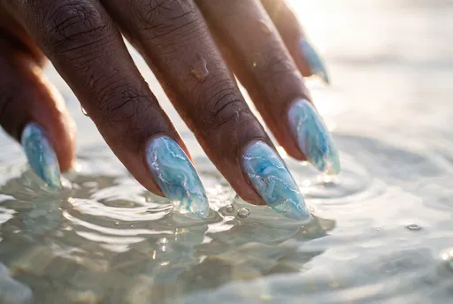 Blue Marble Manicure Dipping Into Water