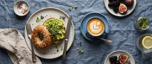 Gourmet Avocado Bagel and Coffee Flat Lay