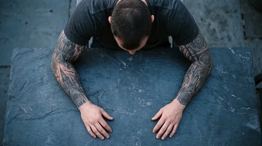 Overhead View of Man's Gothic Sleeve Tattoos