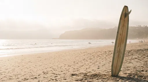 Vintage Surfboard Upright on Hazy Beach