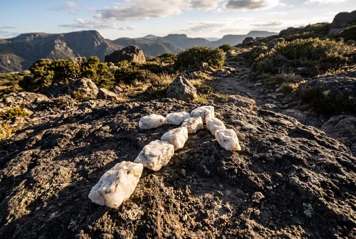 White Quartz Arrow Trail Marker on Mountain