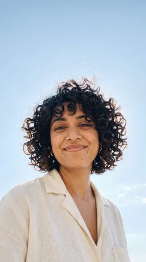 Smiling Woman With Curly Short Bob