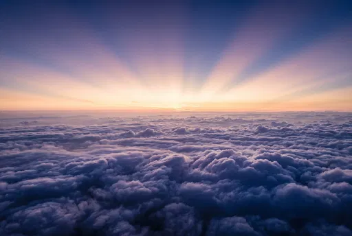 Aerial Sunrise Above Indigo Cloud Deck