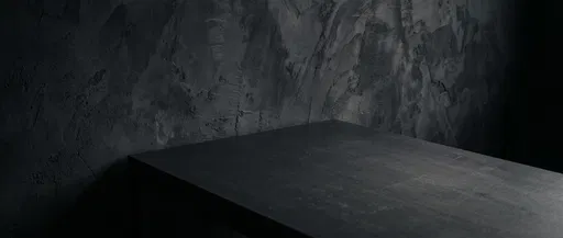 Dark Matte Tabletop Against Textured Charcoal Wall