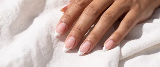 Woman's Hand With French Tip Manicure