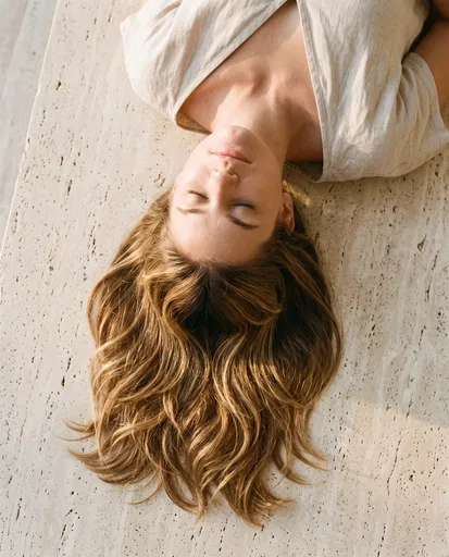 Woman With Layered Hair on Travertine