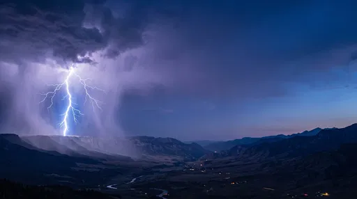 Lightning Strike Over Mountain Valley at Dusk