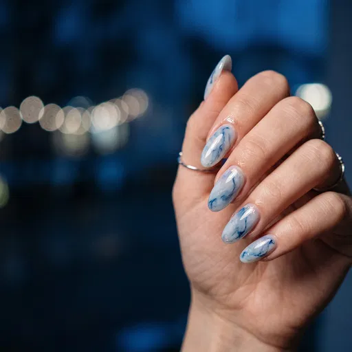 Hand With Blue Marble Nail Art