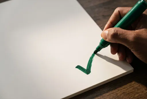 Hand Drawing Green Check Mark on Paper