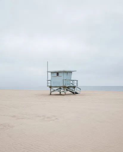 Minimalist Blue Lifeguard Tower on Sandy Beach