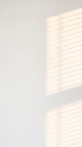 White Plaster Wall With Window Blind Shadows