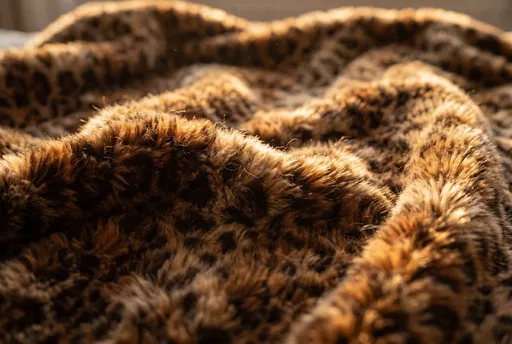 Sunlit Faux Leopard Fur Throw Close-Up
