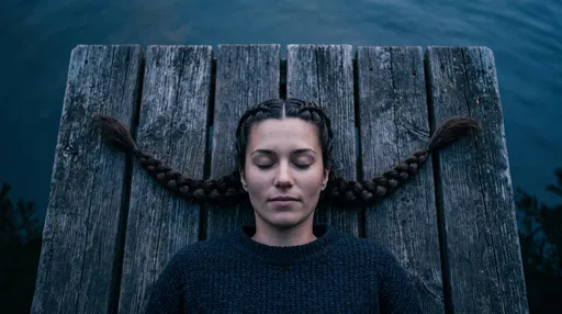 Woman With Braids Lying on Wooden Dock