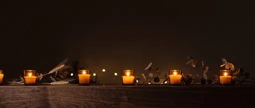 Glowing Votive Candles on Wooden Mantel