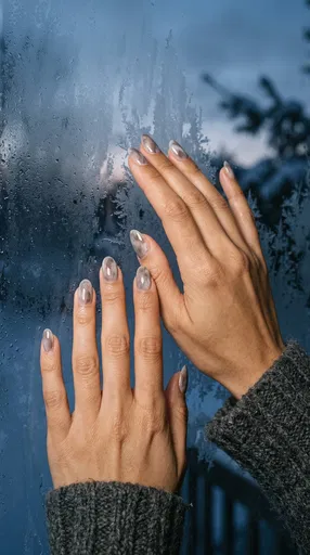 Hands With Marble Nail Art on Window