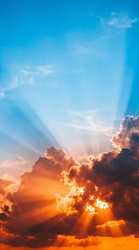 Dramatic Sunbeams Through Fiery Clouds