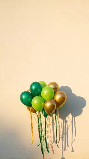Green and Gold Balloons on Cream Wall